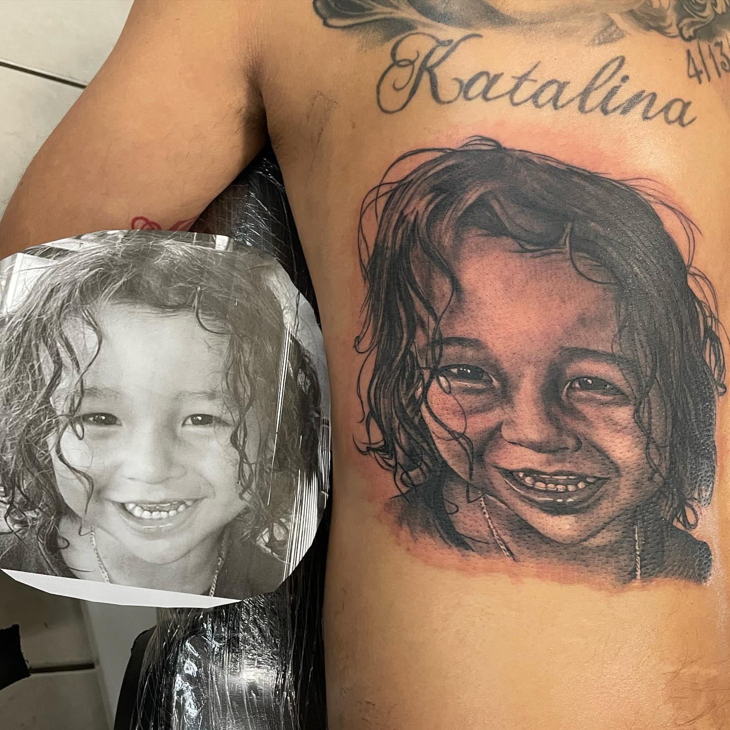 Child's portrait realism tattoo on the chest by payaso