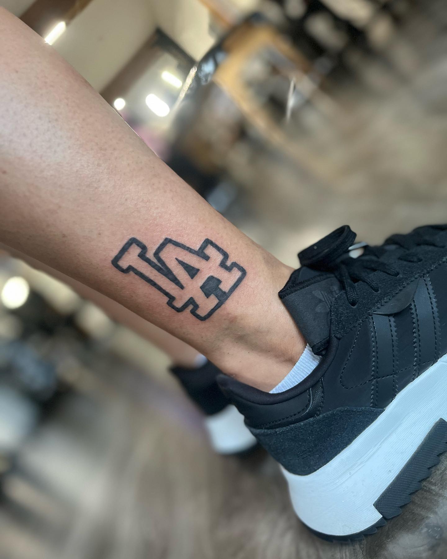 Number 4 lettering script tattoo on the forearm by ๐ธ๐๐๐.๐ฎ๐, Los Angeles, California