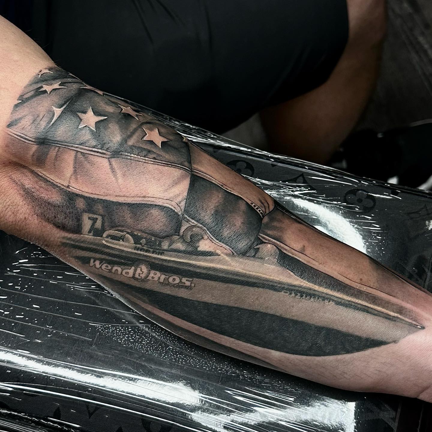 Race car realism tattoo on the forearm by Jayden A