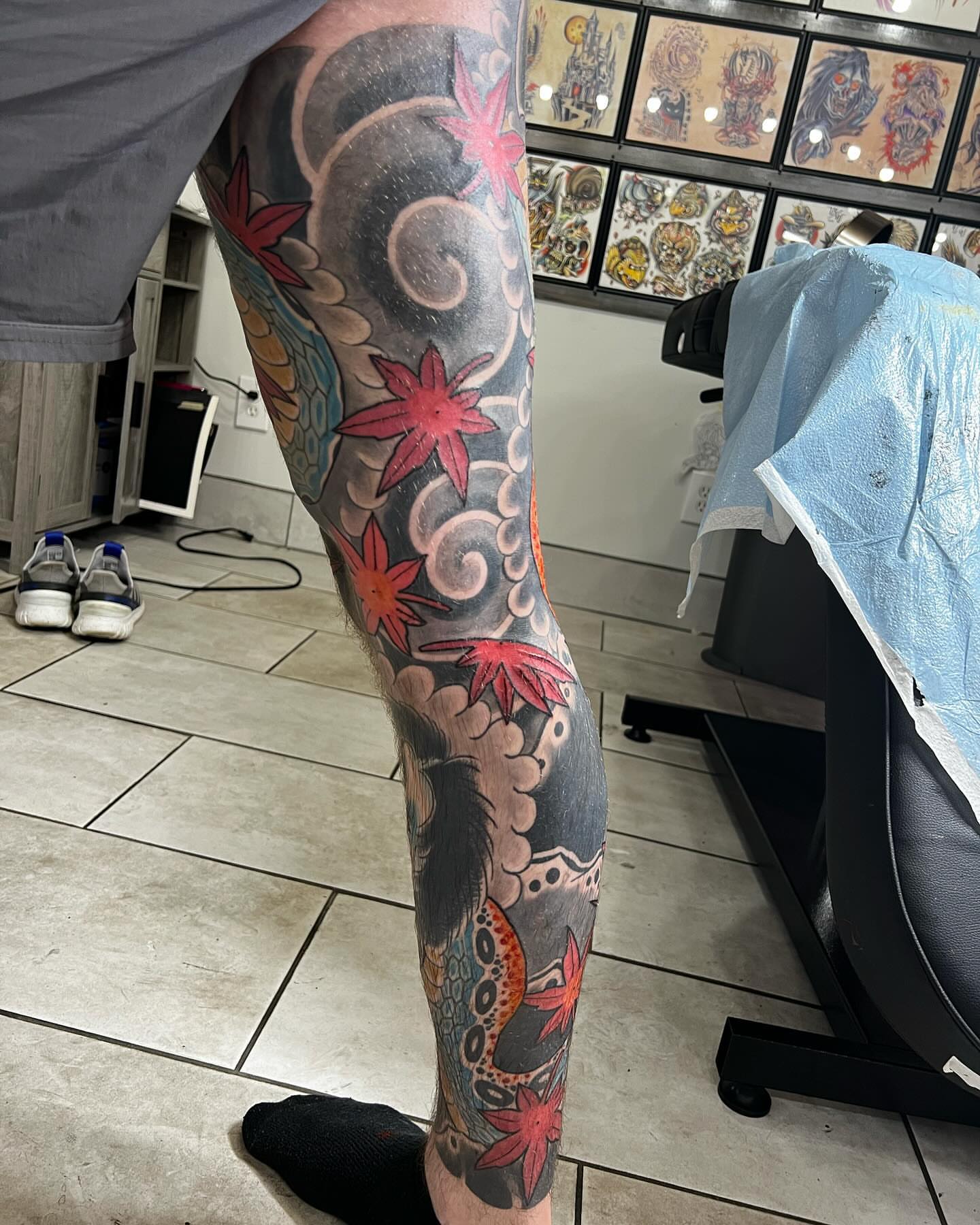 Maple leaves and dragon japanese irezumi tattoo on the leg by Levi Cox, Powell, Ohio