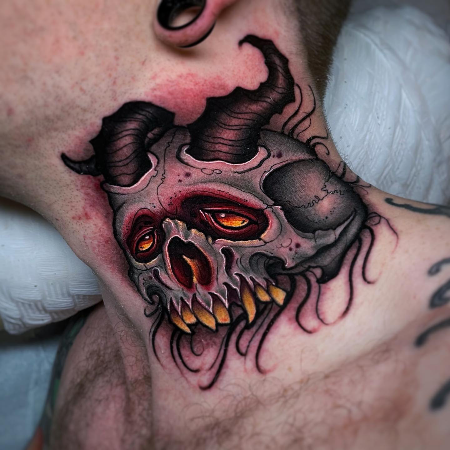Skull dark realism tattoo on the neck by Ick Abrams
