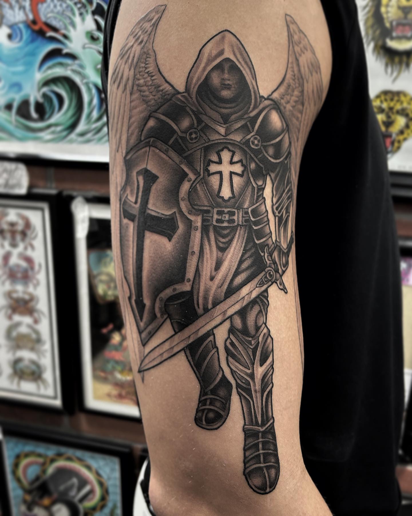 Knight with wings realism tattoo on the forearm by Pat Moser