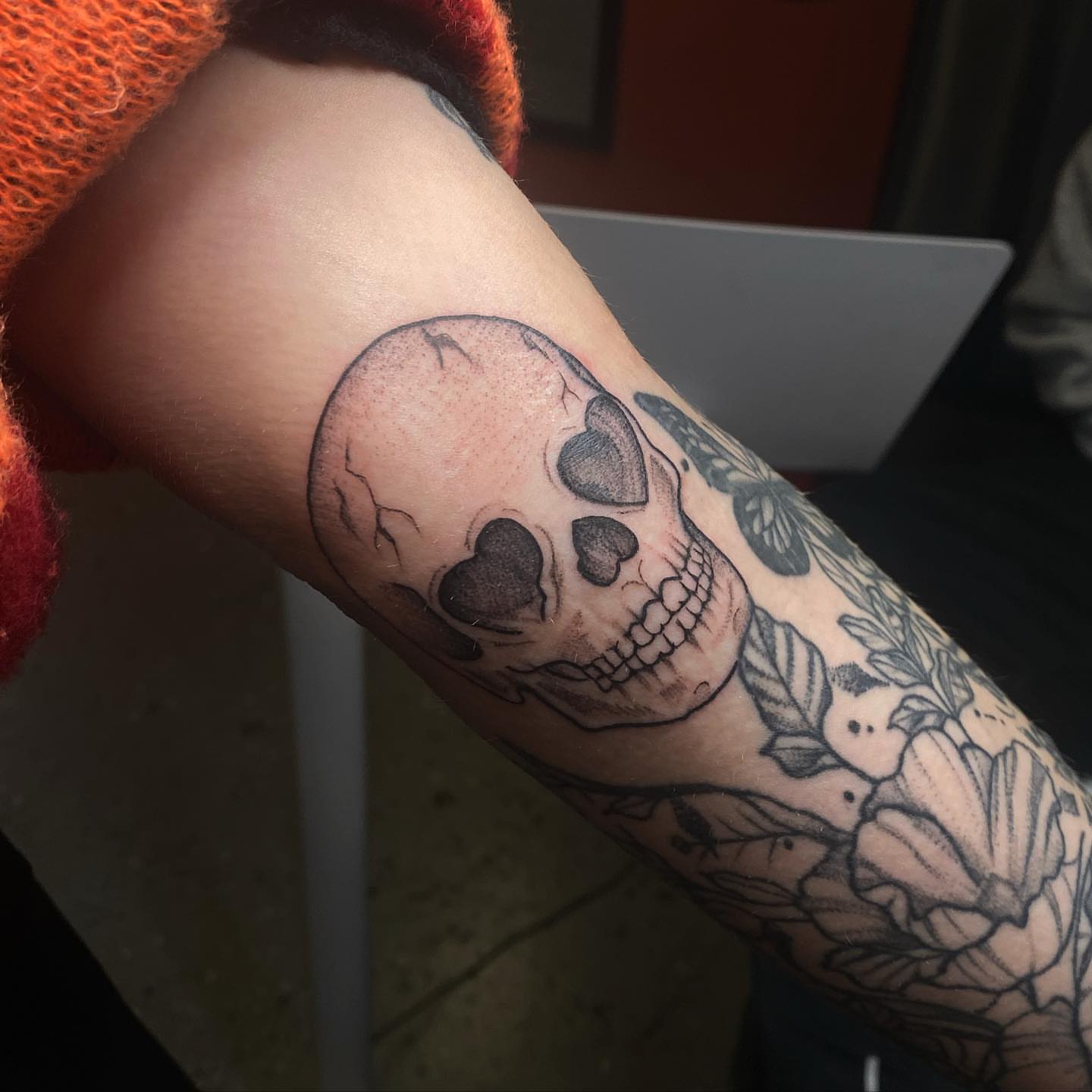 Skull black and grey tattoo on the forearm by Maddie Neibert