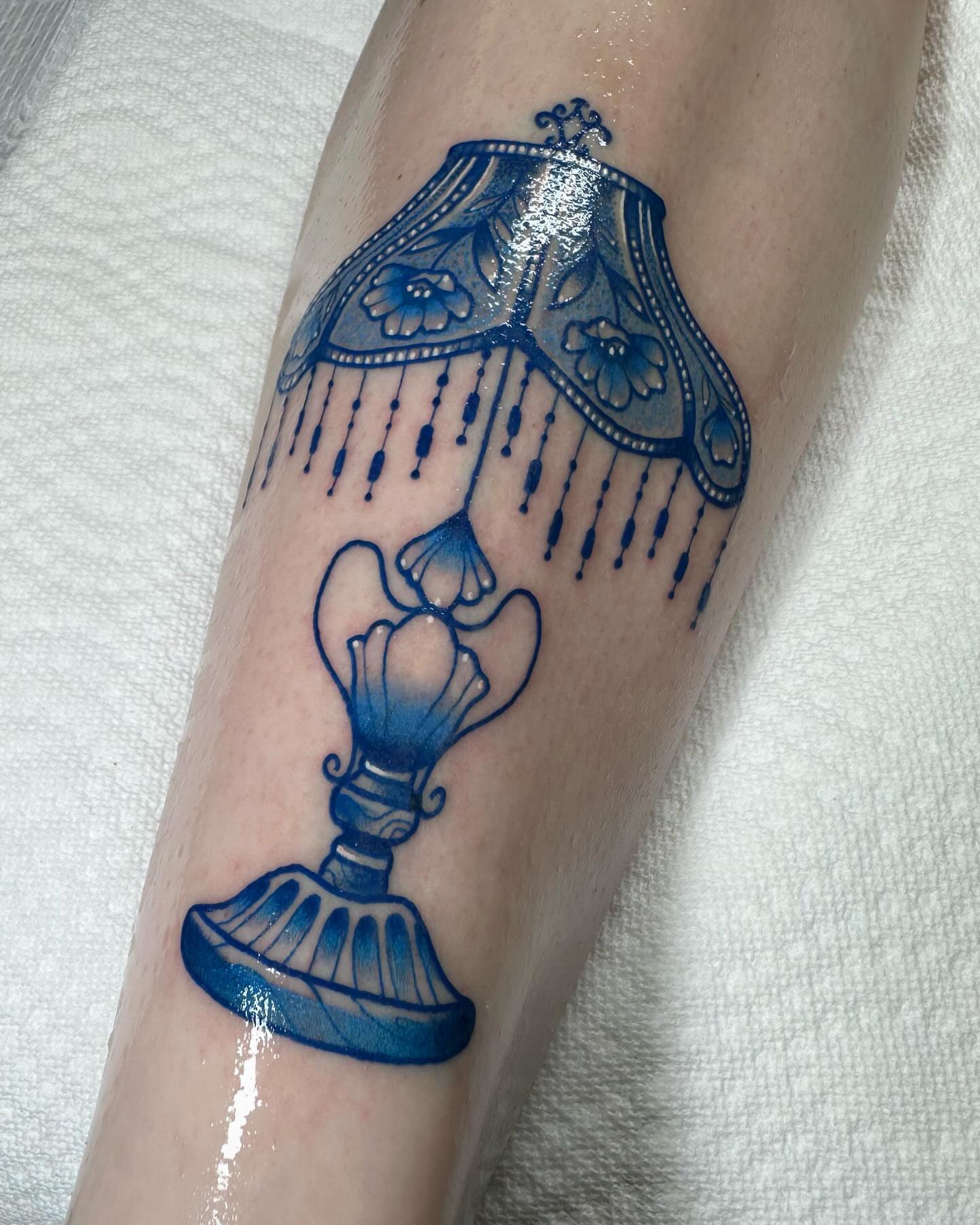 Lampshade ornamental tattoo on the forearm by Katie Kelley