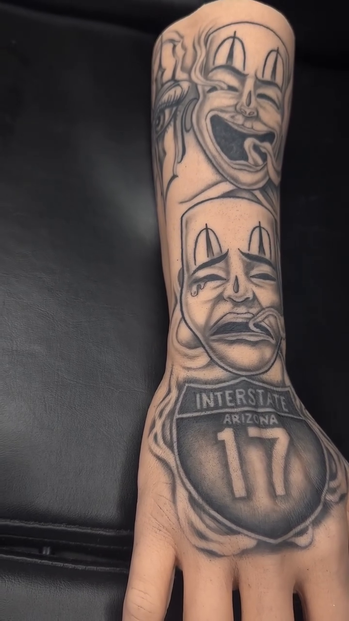Sad clown, happy clown, interstate sign Chicano tattoo by Myles Manuel Lopez, Phoenix, Arizona
