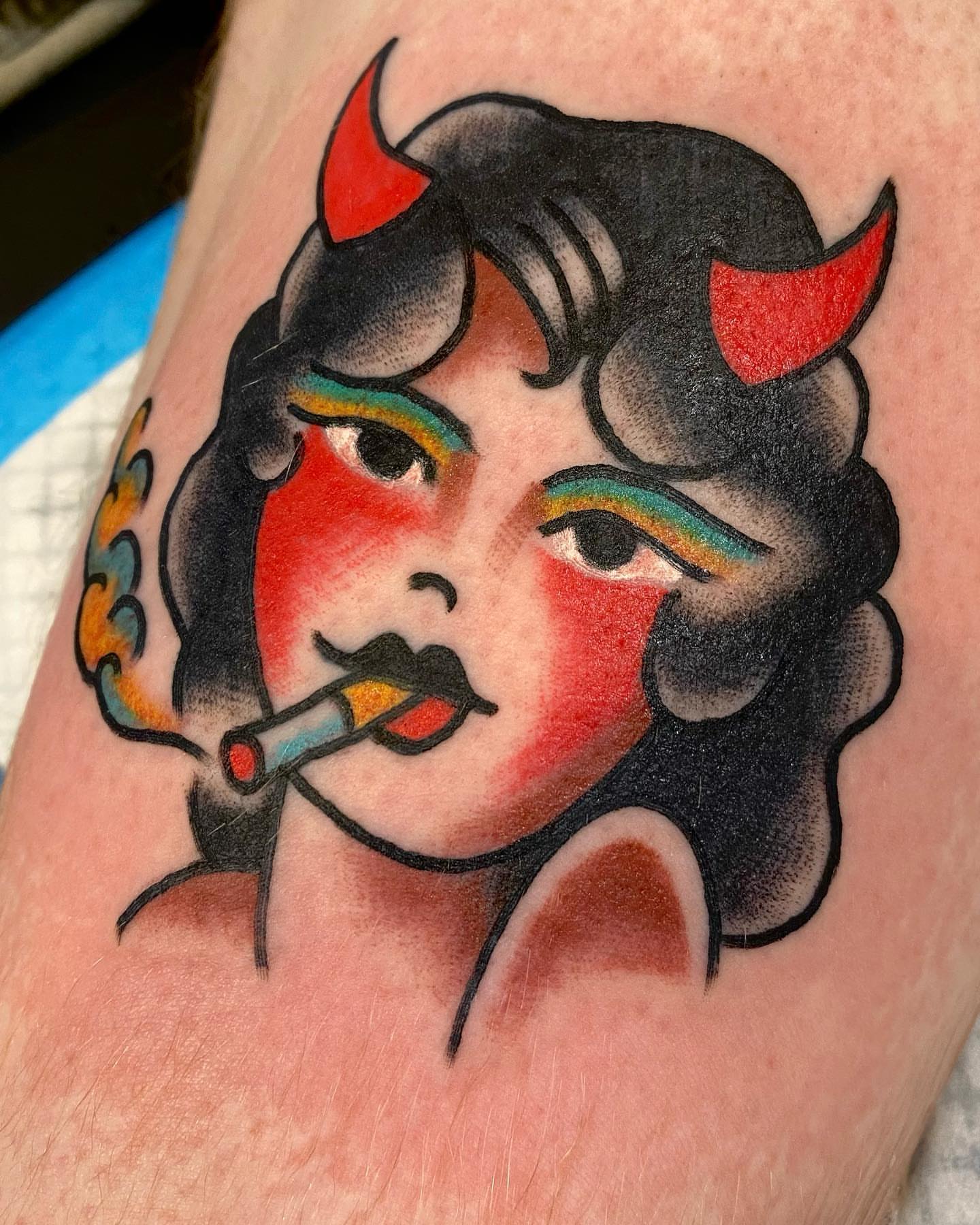 Woman with horns American traditional tattoo on the forearm by Dorian Grey Baker