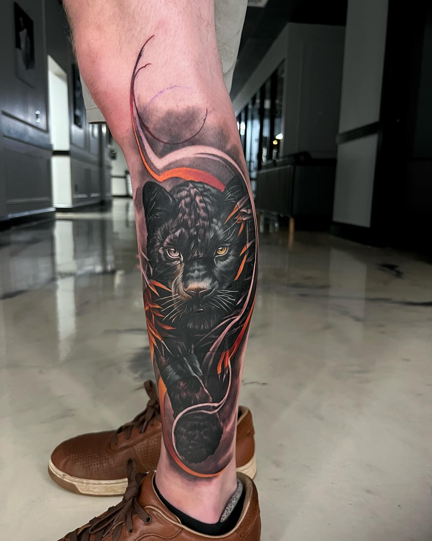 Panther realism tattoo on the calf by Derek Gardner