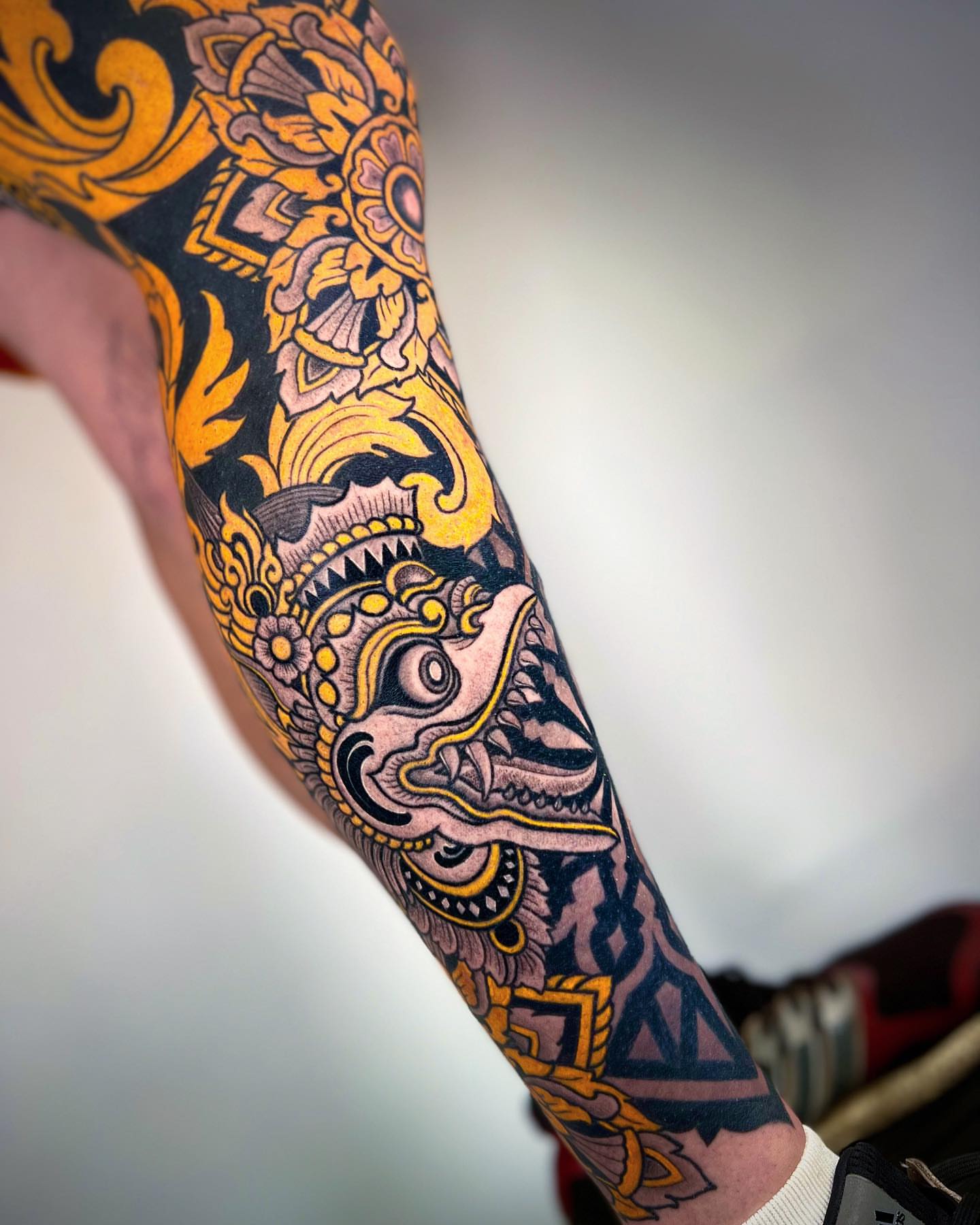 Mask ornamental tattoo on the forearm by Aries Rhysing, Wheat Ridge, Colorado