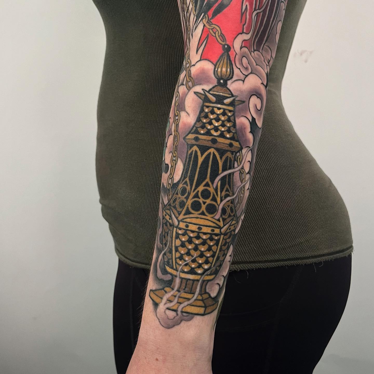 Lantern American traditional tattoo on the forearm by Sara Lewis