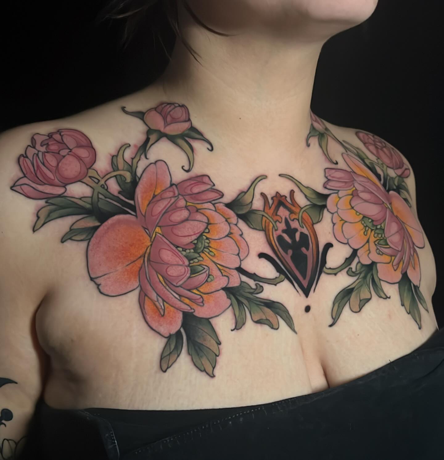 Floral arrangement American traditional tattoo on the chest by Tony Trophy