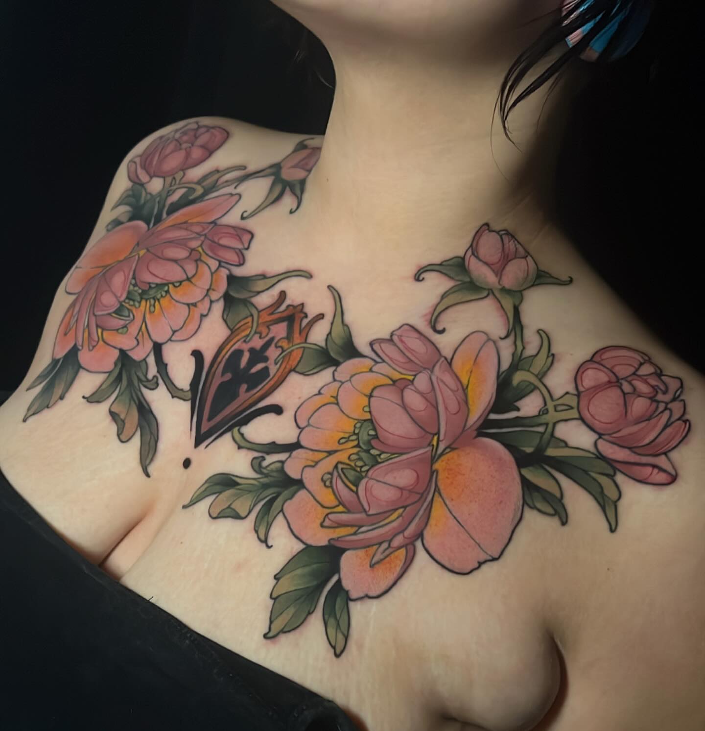 Floral bouquet American traditional tattoo on the chest by Tony Trophy
