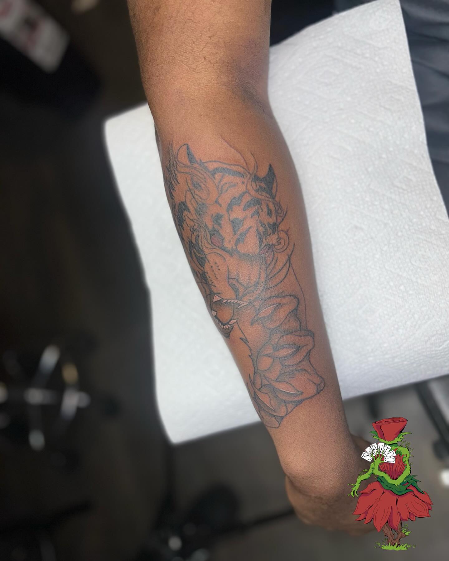 Rose and skull realism tattoo on the forearm by Marques Neal