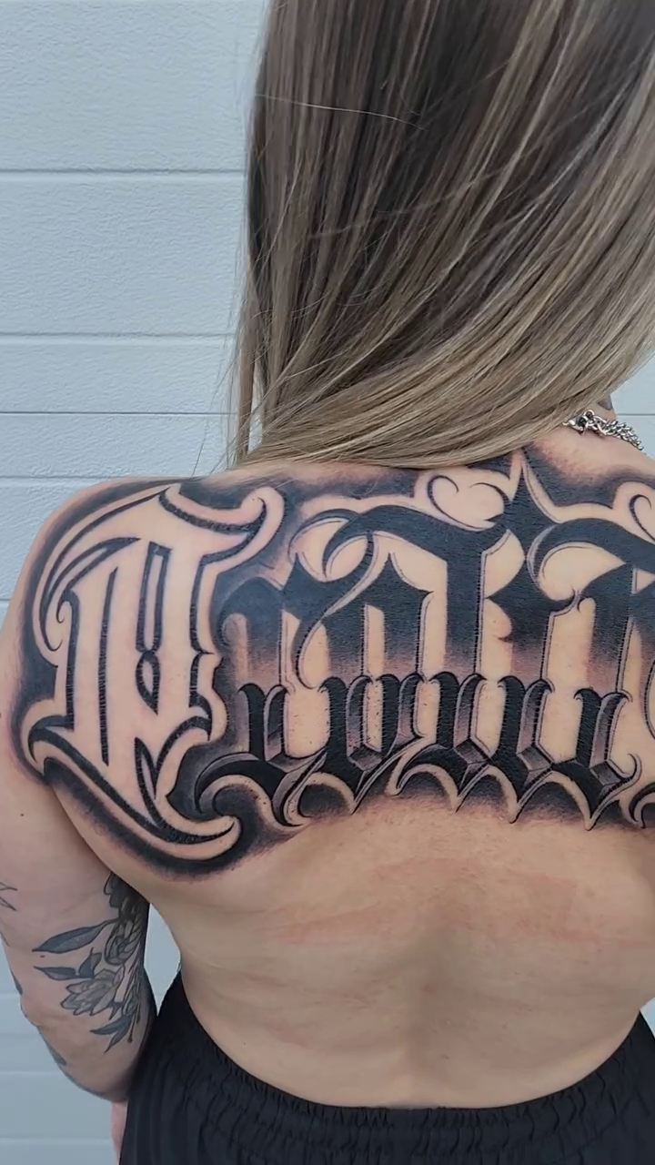 The word 'MOM' lettering script tattoo by mr.scriptkeeper