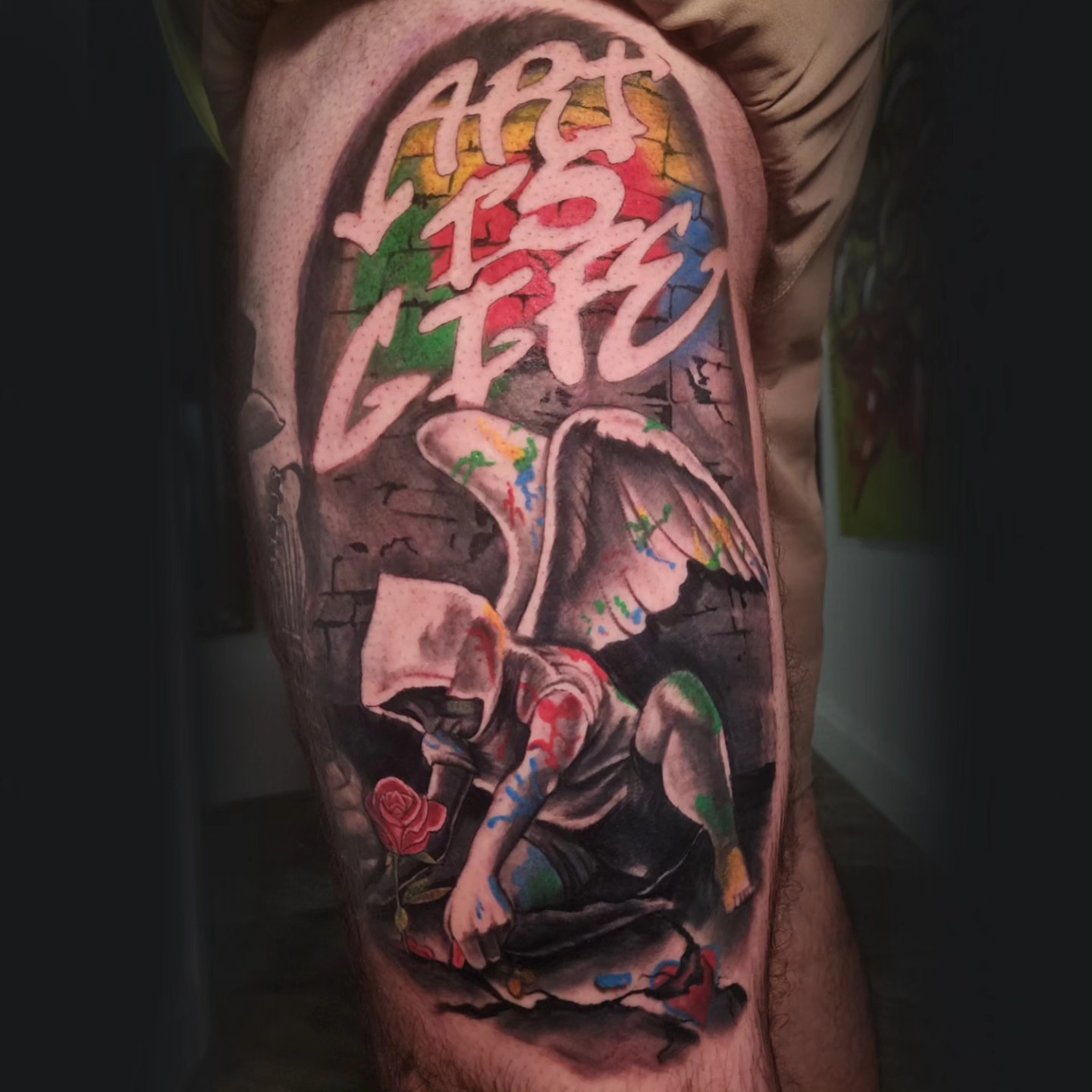 Artist with paintbrush realism tattoo on the forearm by Tyler Cromwell