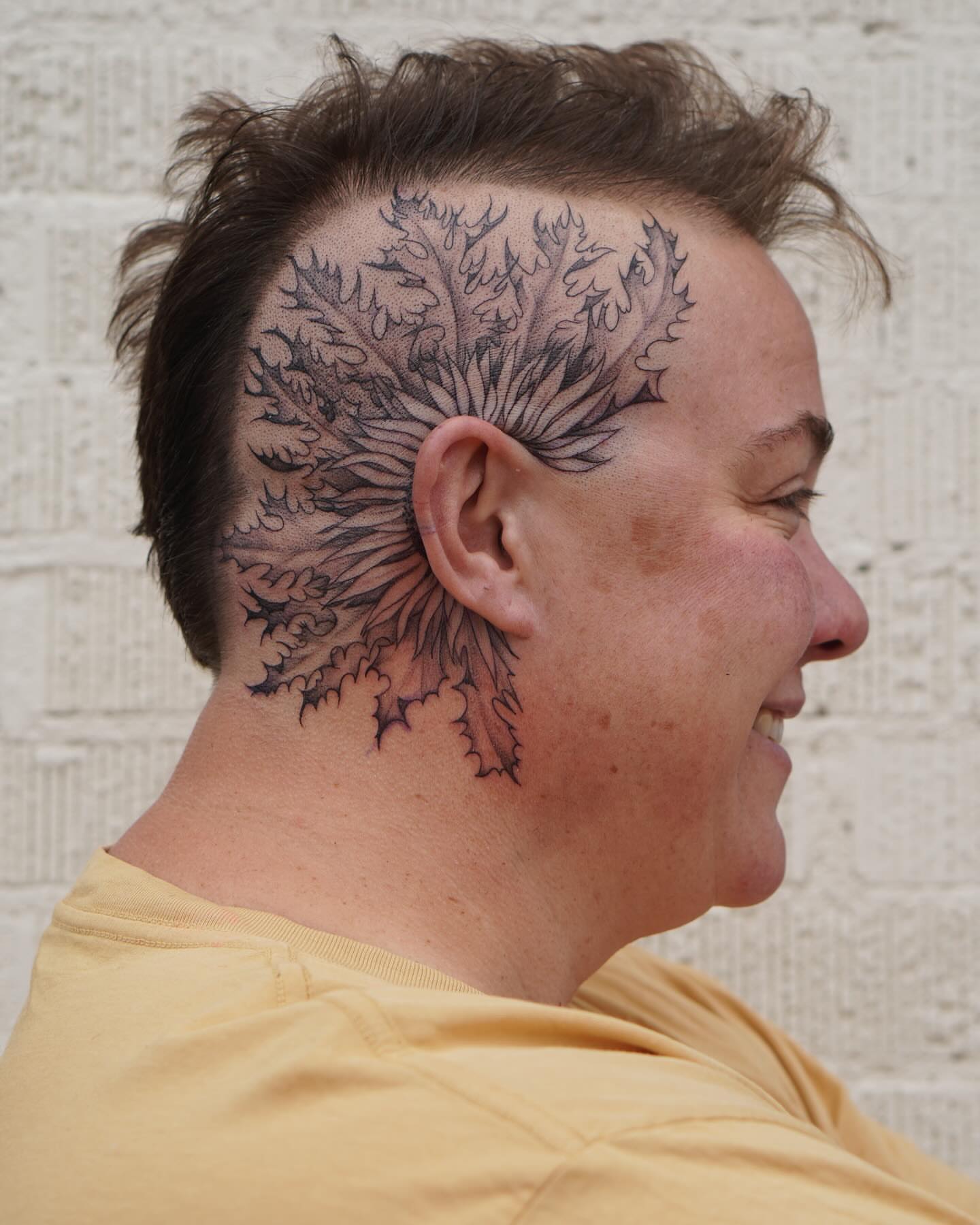 Thistle black and grey tattoo on the head by Stephanie Shortsleeve