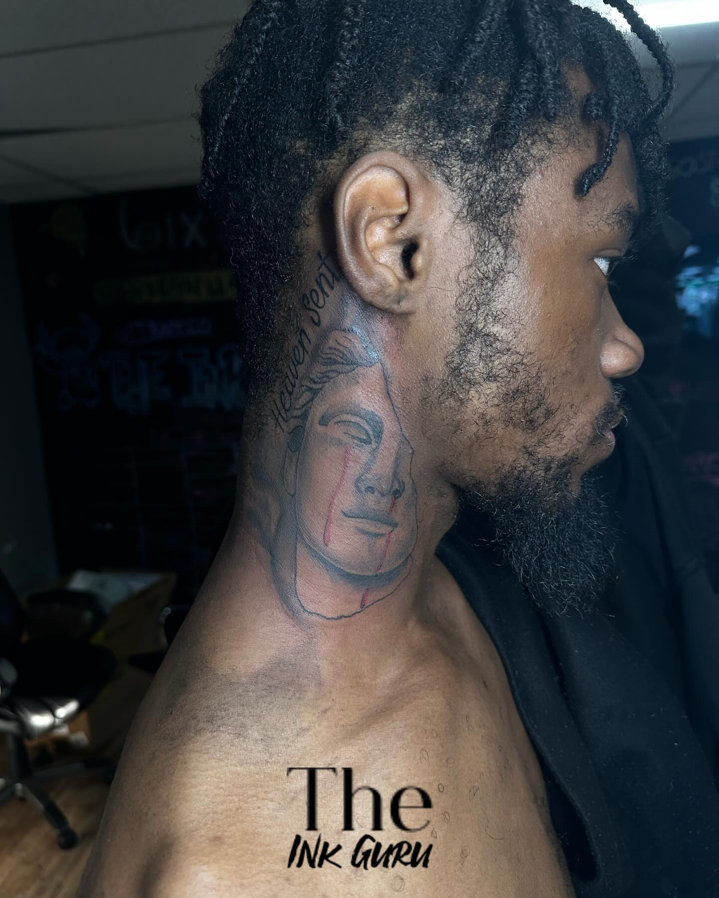 Man's face realism tattoo on the neck by The Ink Guru.