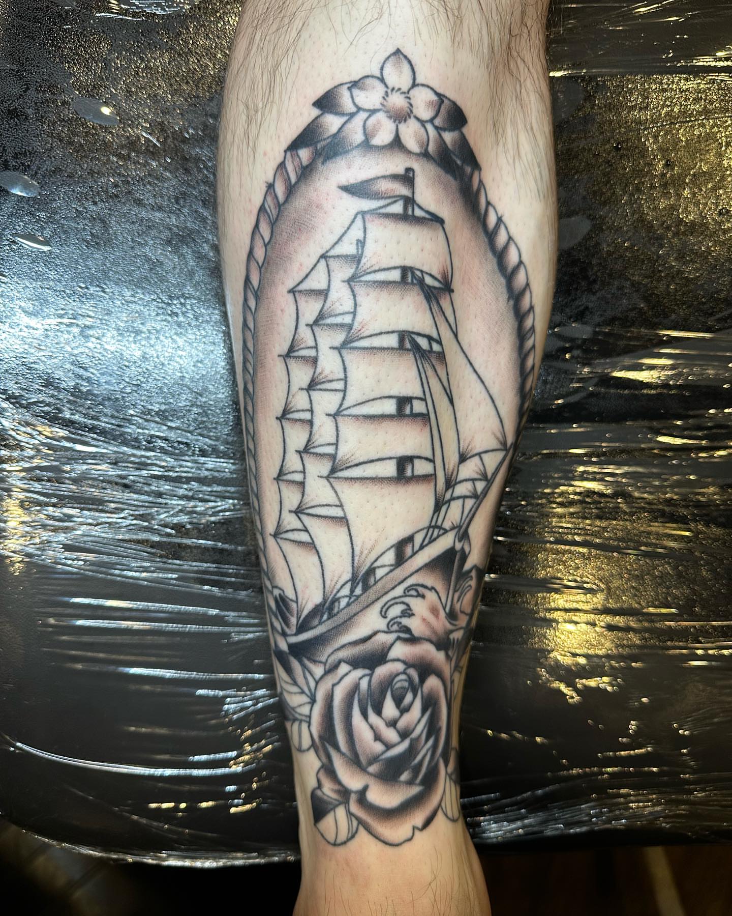 Sailboat and rose American traditional tattoo on the forearm by SAL, Mesa, Arizona