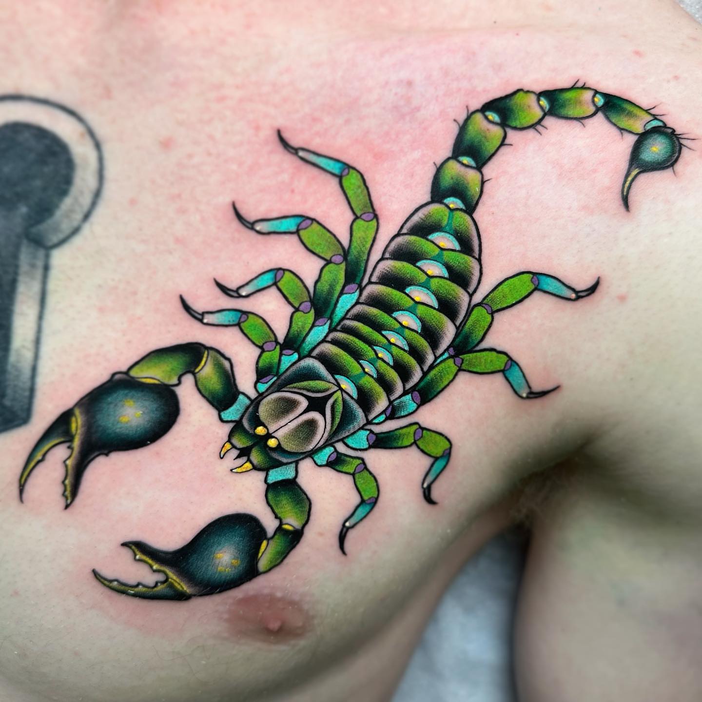 Scorpion American traditional tattoo on the shoulder by Patrick Whiting