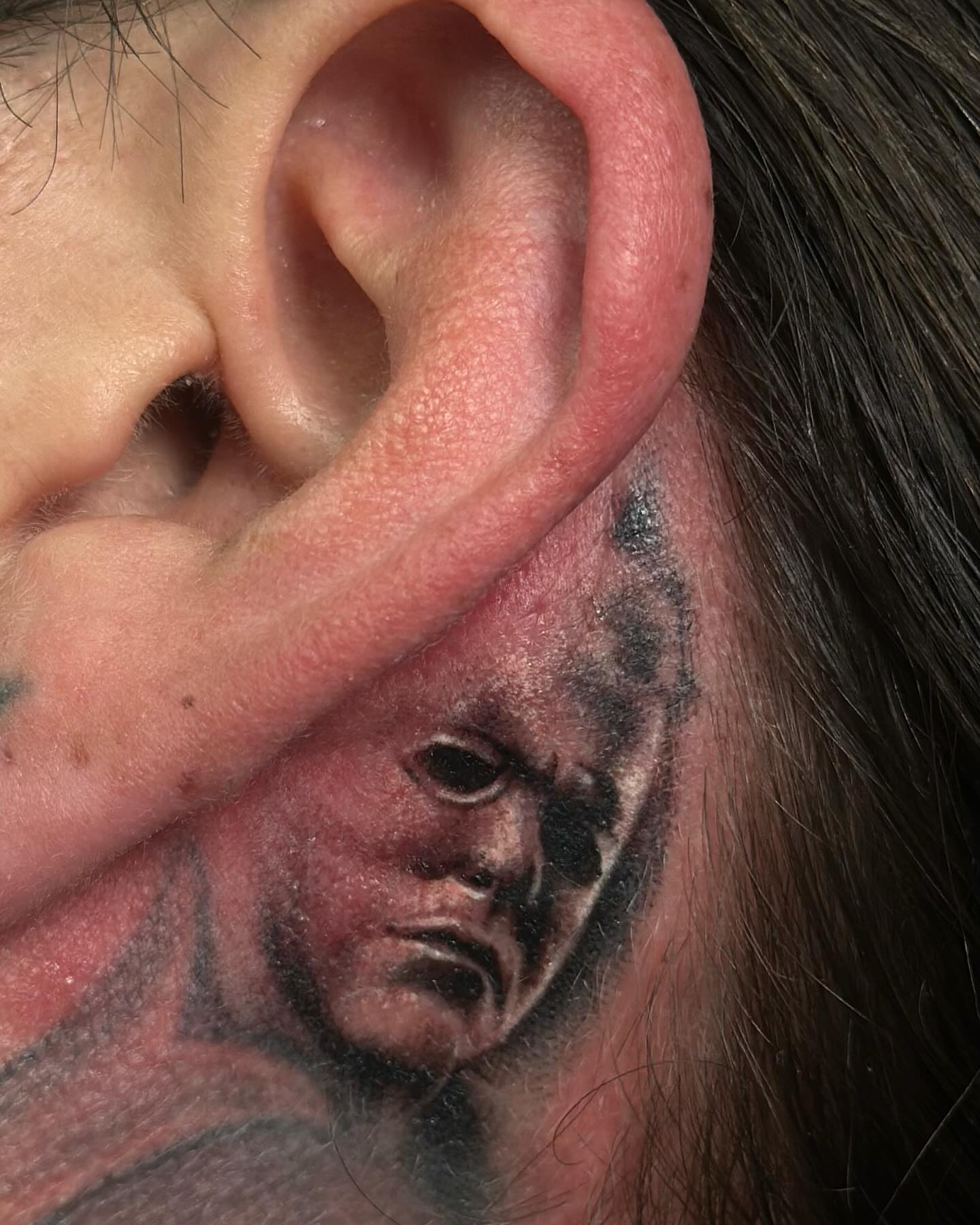 Portrait realism tattoo on the head by Trevor Sibary