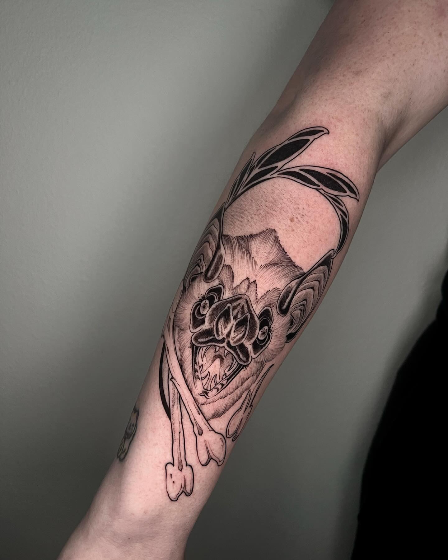 Skull and roses realism tattoo on the forearm by Angelo Buonanno, Las Vegas, Nevada