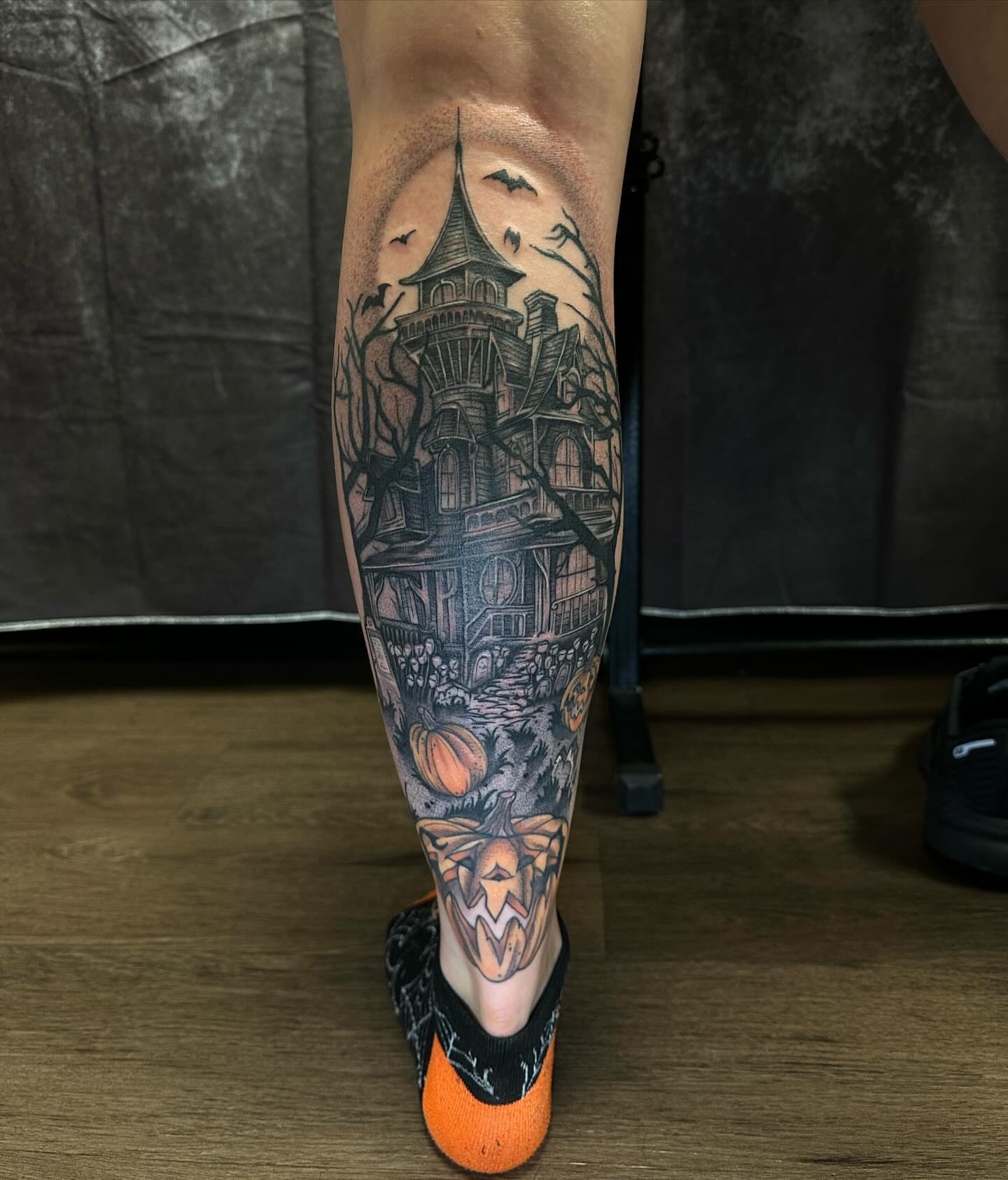 Haunted house dark realism tattoo on the calf by Valen Laska