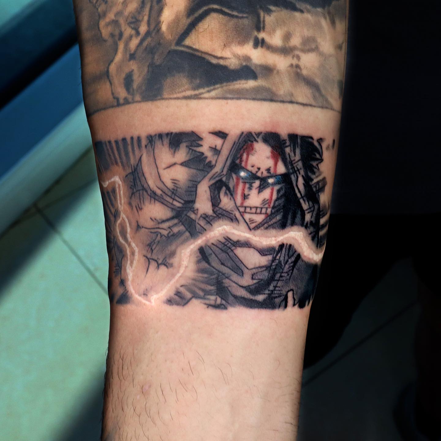 Anime character anime tattoo on the forearm by Tattoo Artist