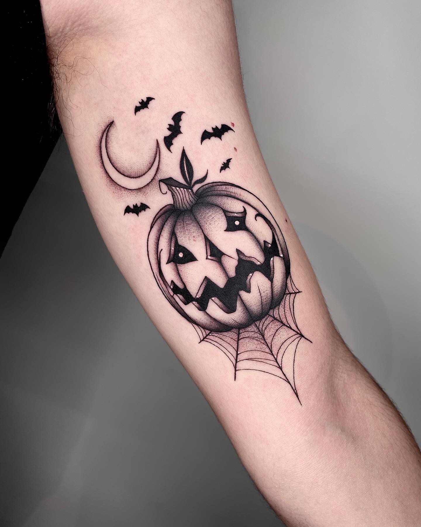 Pumpkin black and grey tattoo on the forearm by LA tattoo