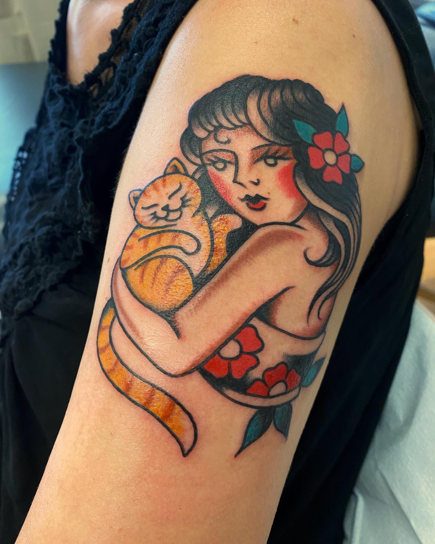 Woman hugging cat American traditional tattoo on the upper arm by Alan Pham, San Jose, California