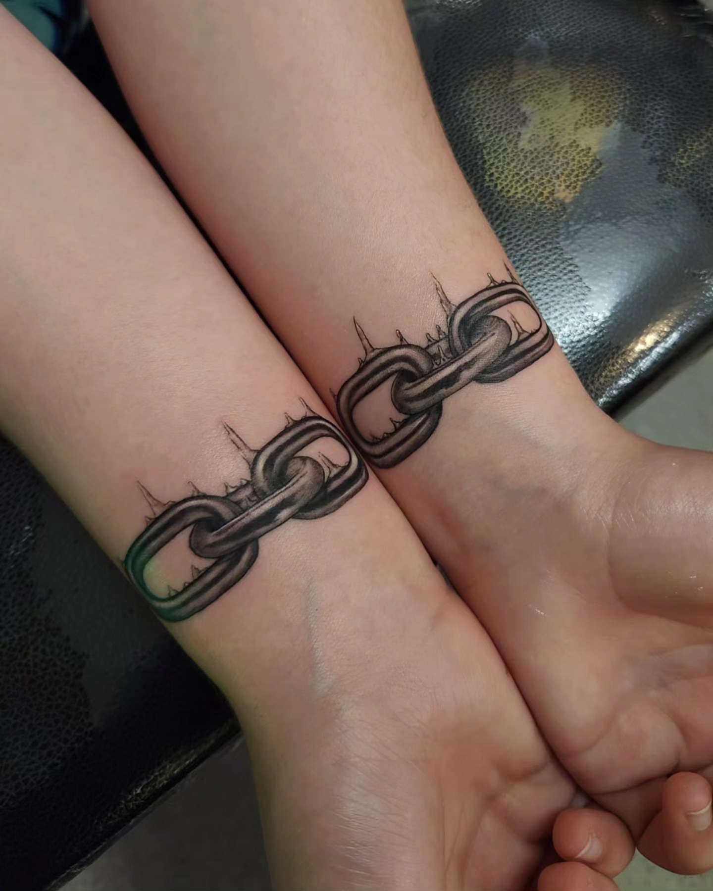 Chain black and grey tattoo on the forearm by Adrian Chavez