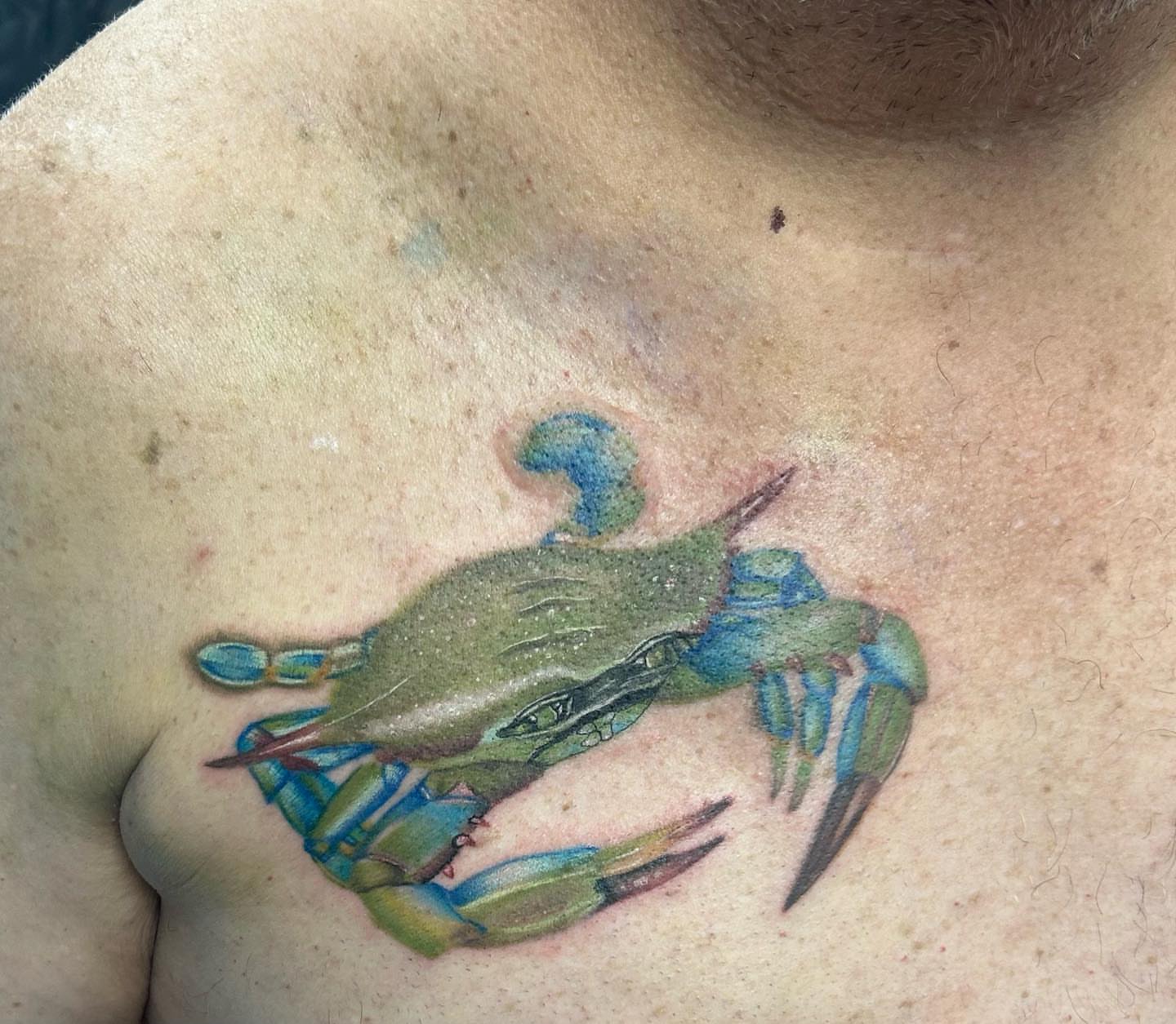 Blue crab realism tattoo on the chest by Anahi