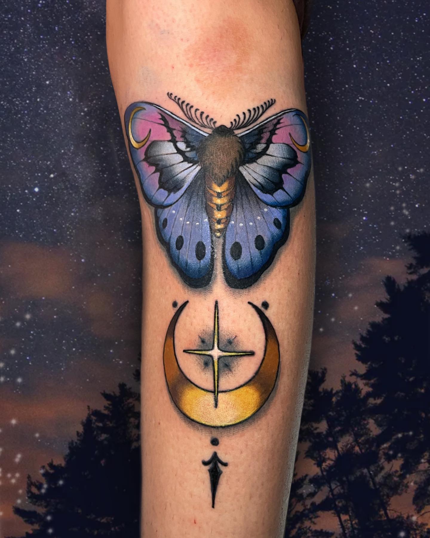 Butterfly and crescent moon dotwork tattoo on the forearm by Wendy Ruiz