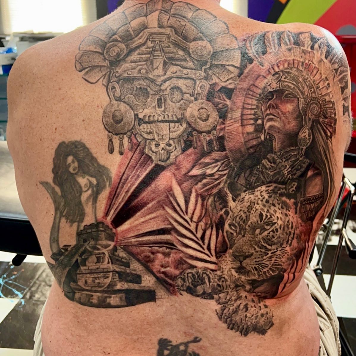 Indian warrior and jaguar realism tattoo on the back by Dre Ortiz