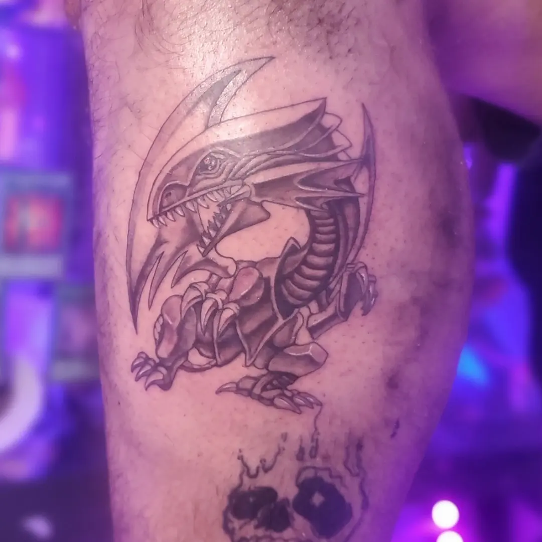 Dragon black and grey tattoo on the forearm by Joc