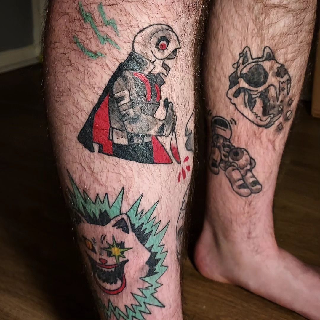 Mechanical characters American traditional tattoo on the calf by Spike Cameron