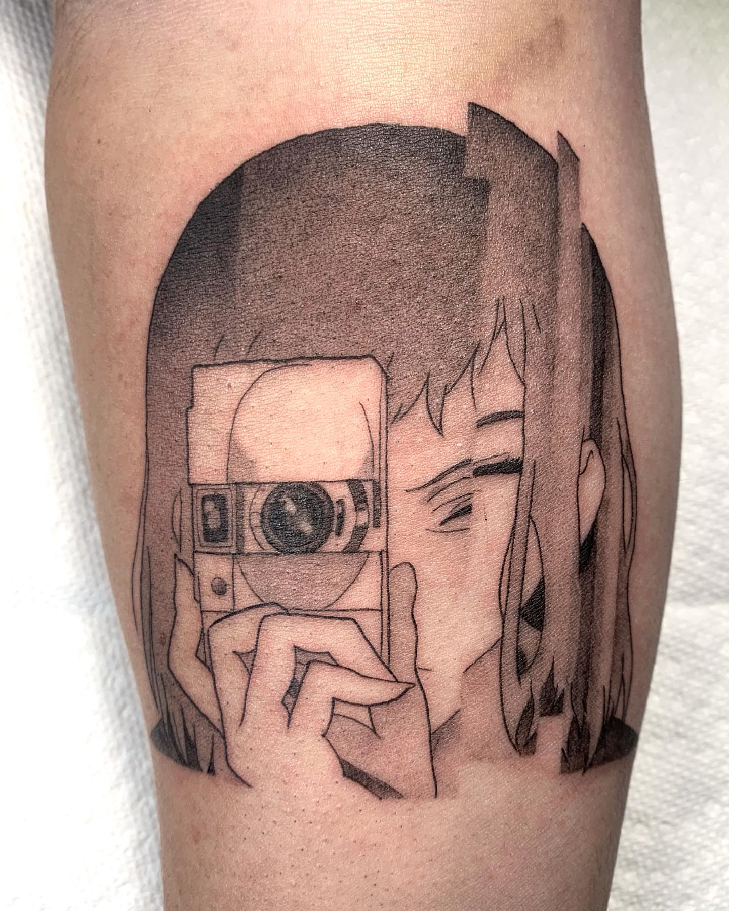 Anime character anime tattoo on the forearm by Sarah