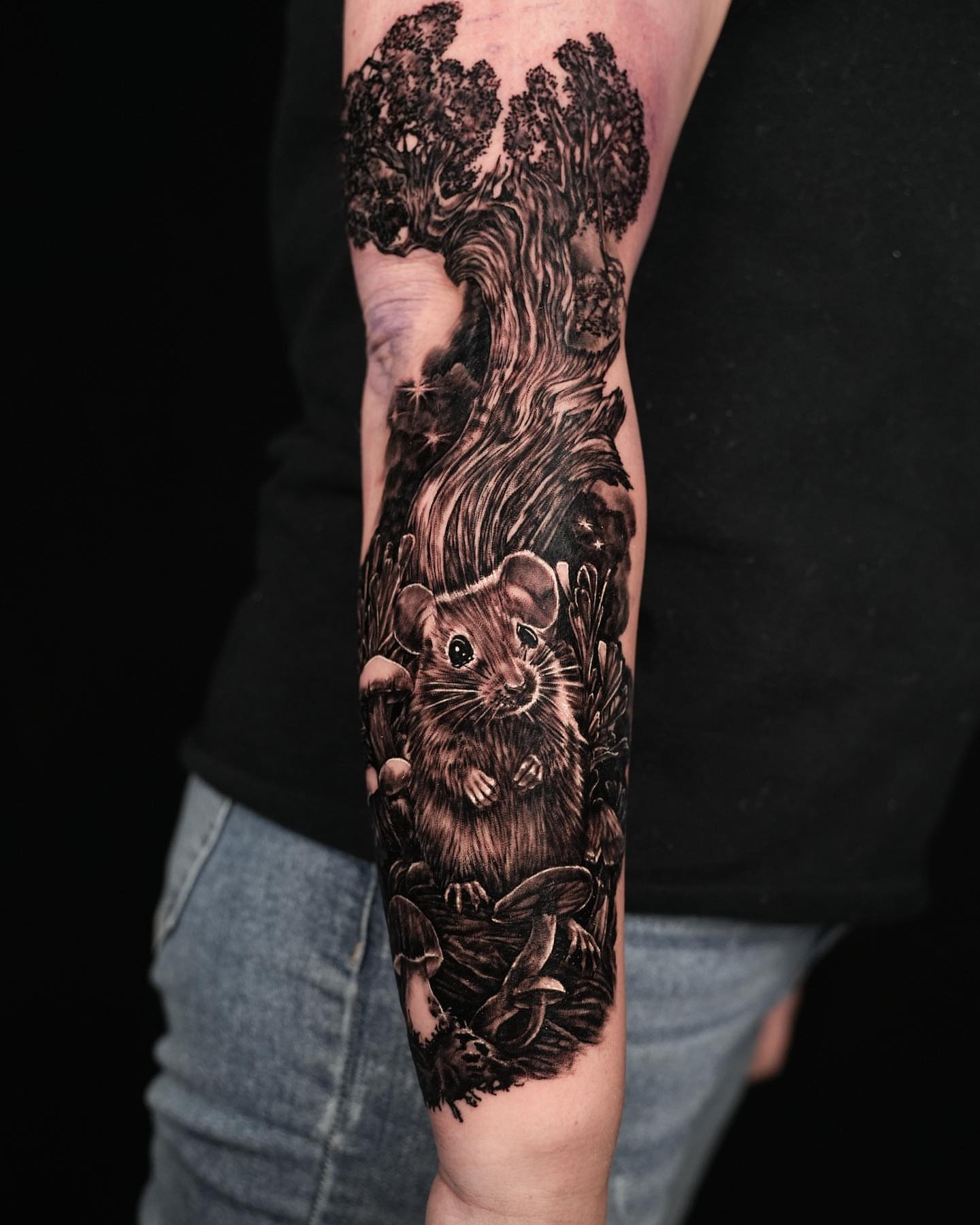 Mouse in forest realism tattoo on the forearm by Stacy Lavette