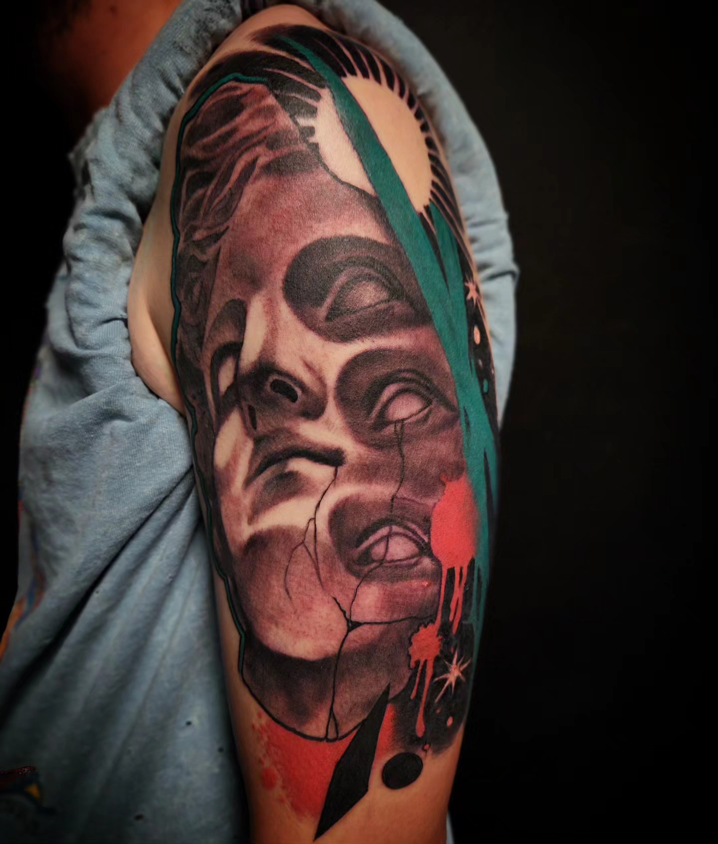Horror face dark realism tattoo on the upper arm by Ben Friday, Phoenix, Arizona