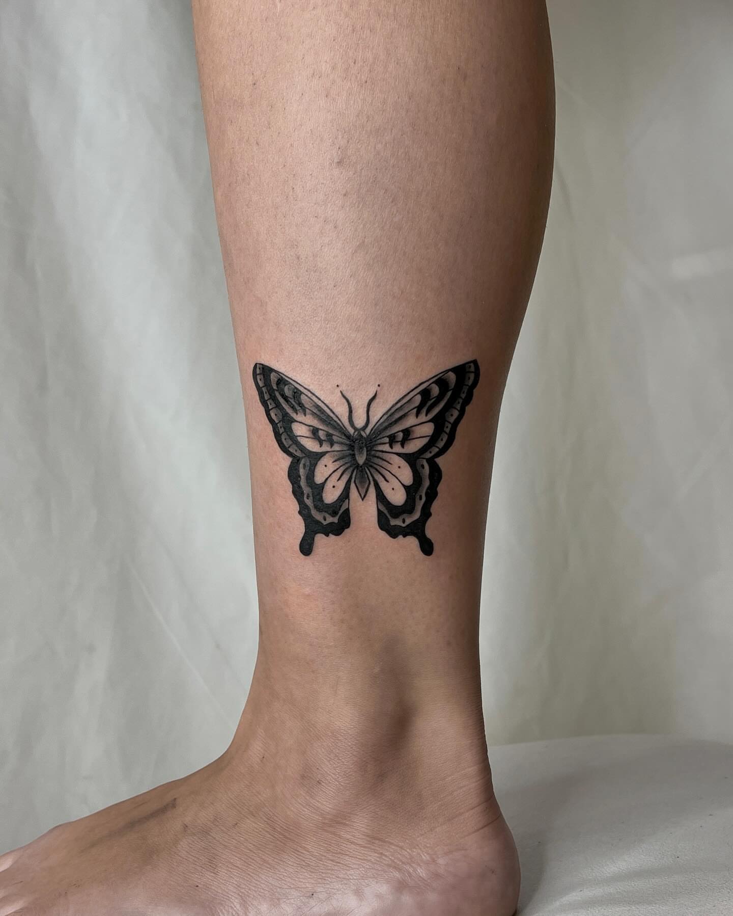 Butterfly black and grey tattoo on the calf by Rebel milly Tattoo