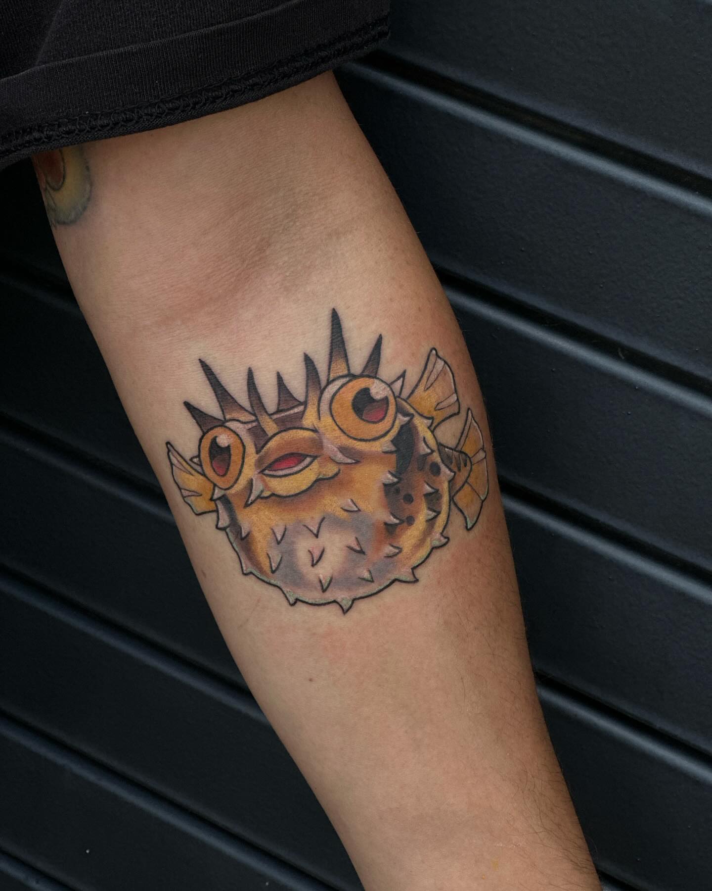 Puffer fish realism tattoo on the forearm by Sarah Bobby, Houston, Texas