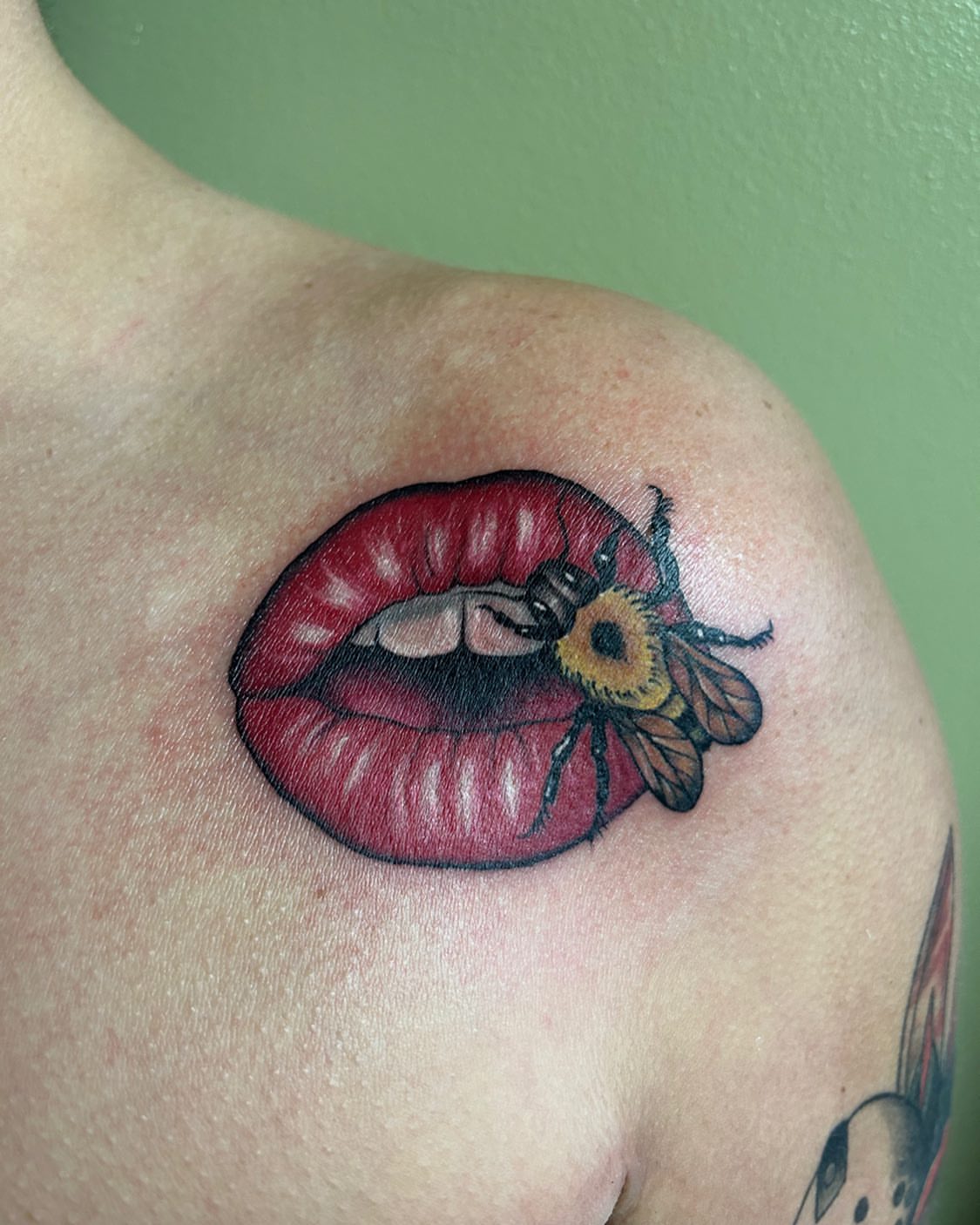 Lips and bee realism tattoo on the shoulder by ππππππ ππππππ