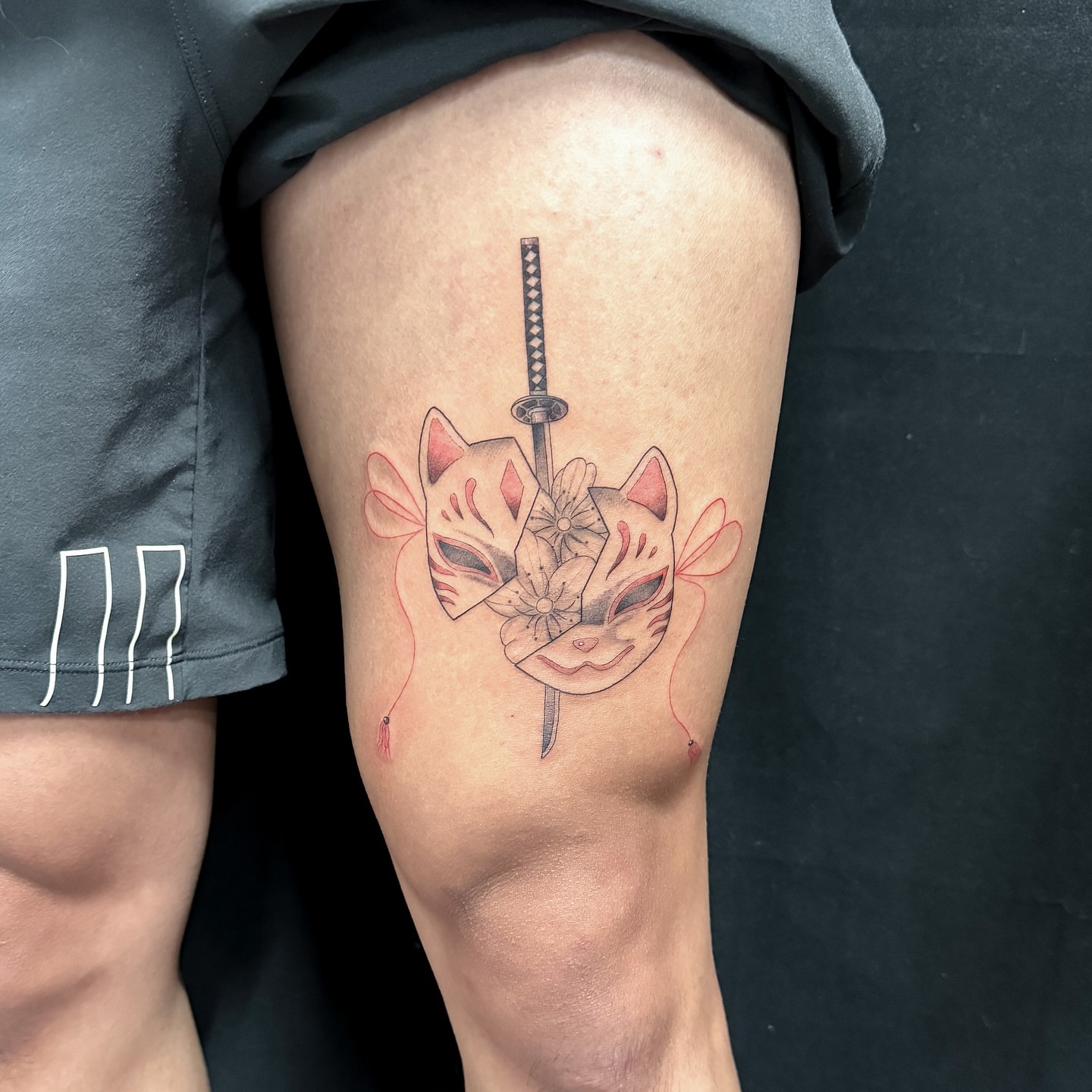 Cat mask and katana dotwork tattoo on the thigh by INK by CEE