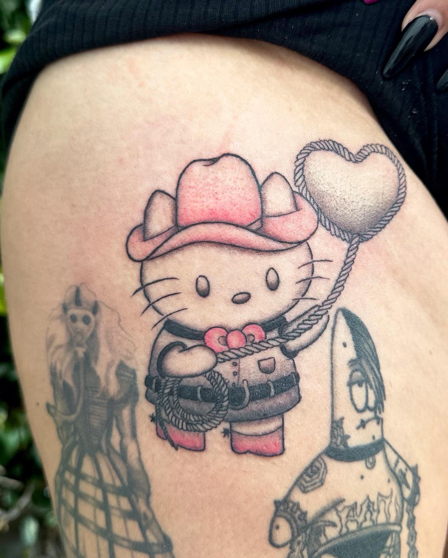 Cowboy hello kitty new school tattoo on the thigh by Mika