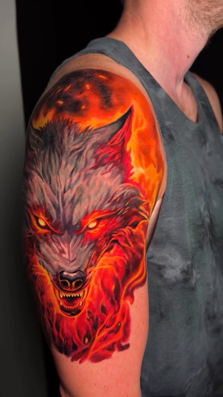 Wolf head with fiery background realism tattoo by Jamie Lee Parker