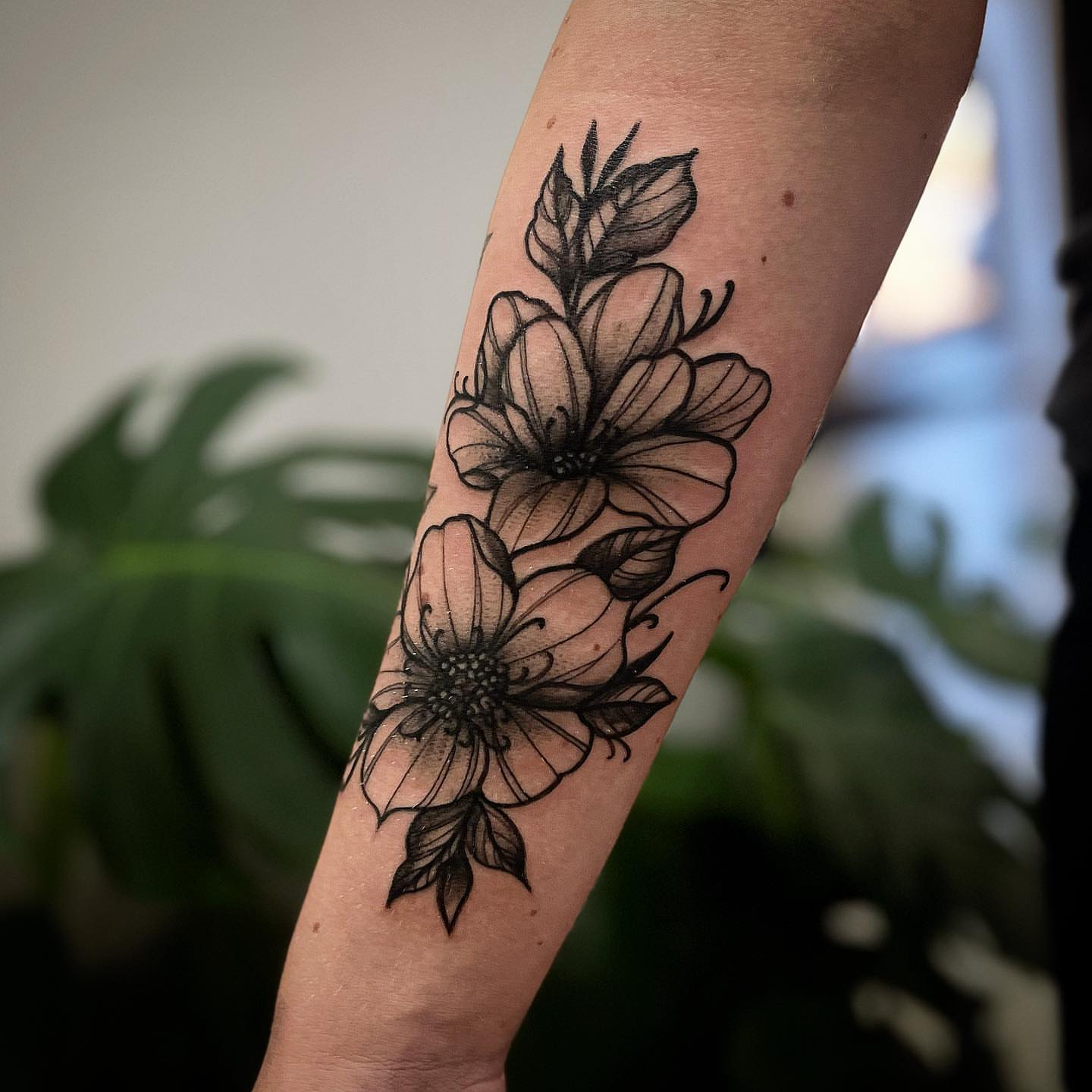 Flowers black and grey tattoo on the forearm by π΅πππππ