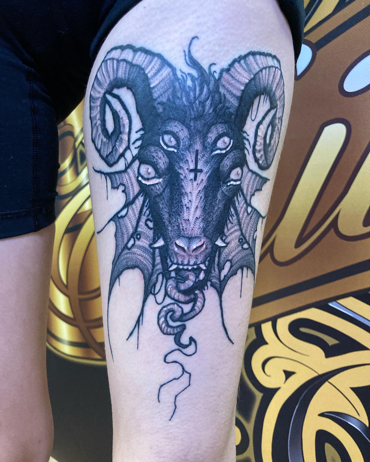 Ram head black and grey tattoo on the forearm by Griffin Benson