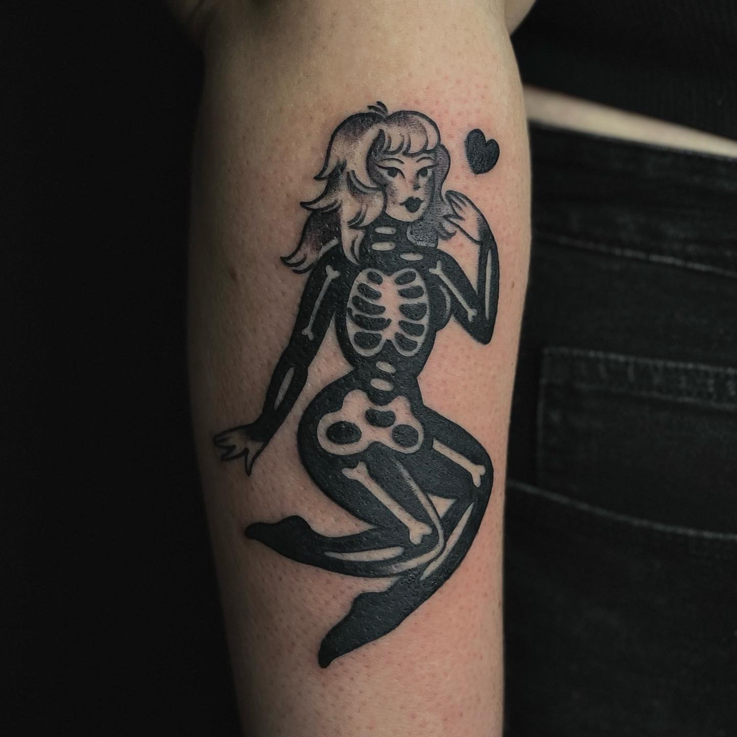 Skeleton mermaid black and grey tattoo on the forearm by Luna