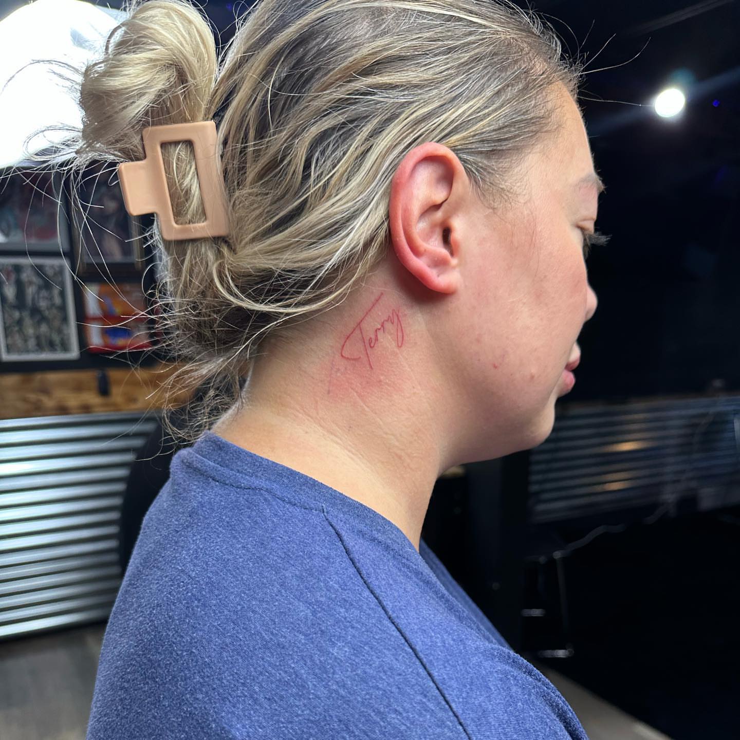 Name lettering script tattoo on the neck by Emmy