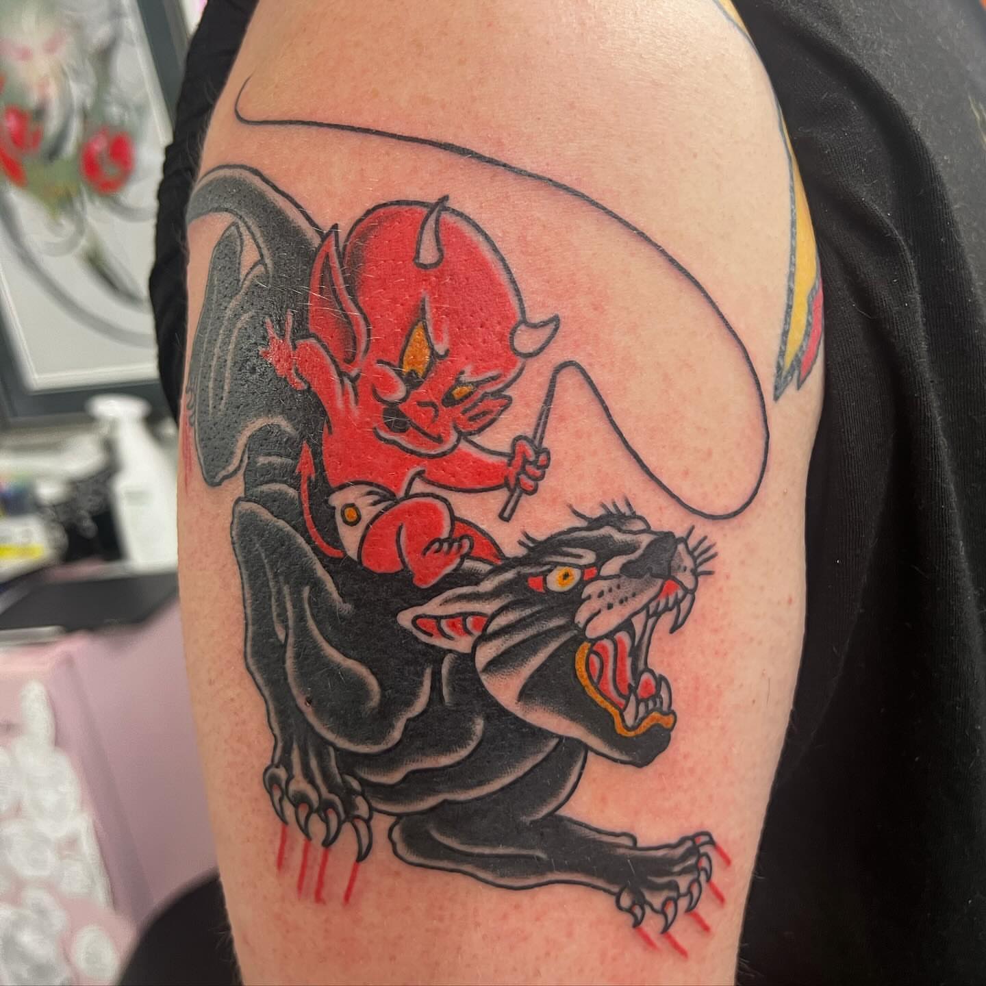 Demon riding panther American traditional tattoo on the shoulder by Levi Cox, Powell, Ohio