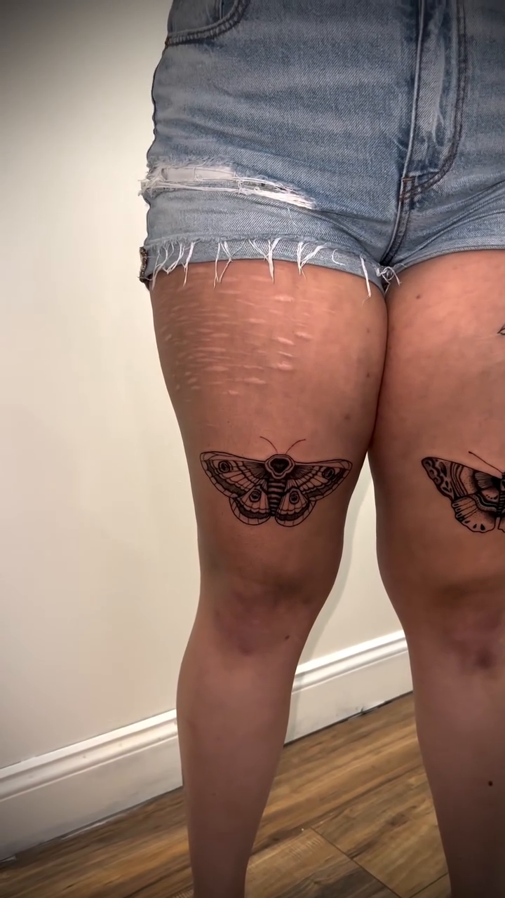 Moth and floral arrangement realism tattoo by Tim Faulkner