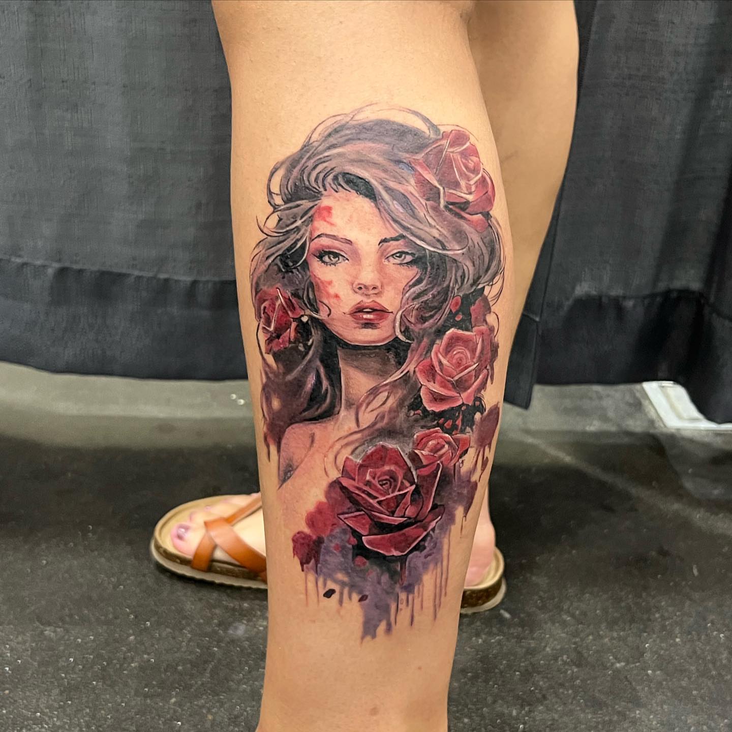 Woman with roses realism tattoo on the thigh by Seth Scott